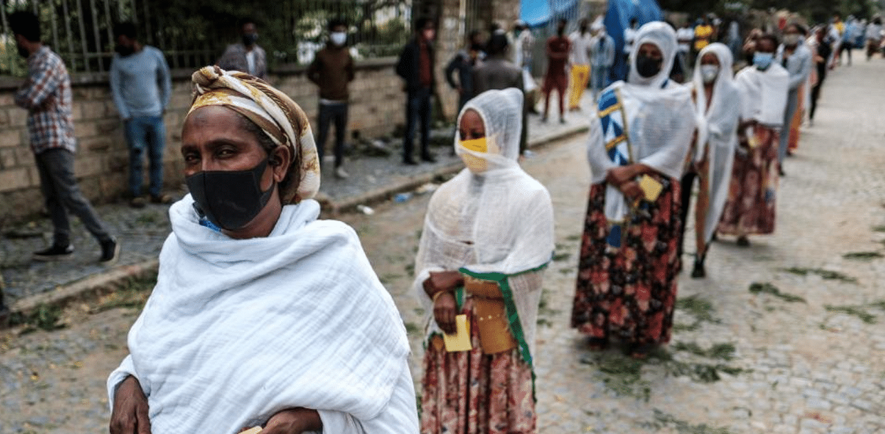 Women wait in line in order to enter a polling station during Tigray’s regional elections in the city of Mekele, Ethiopia, on September 9, 2020. Credit: AFP Photo