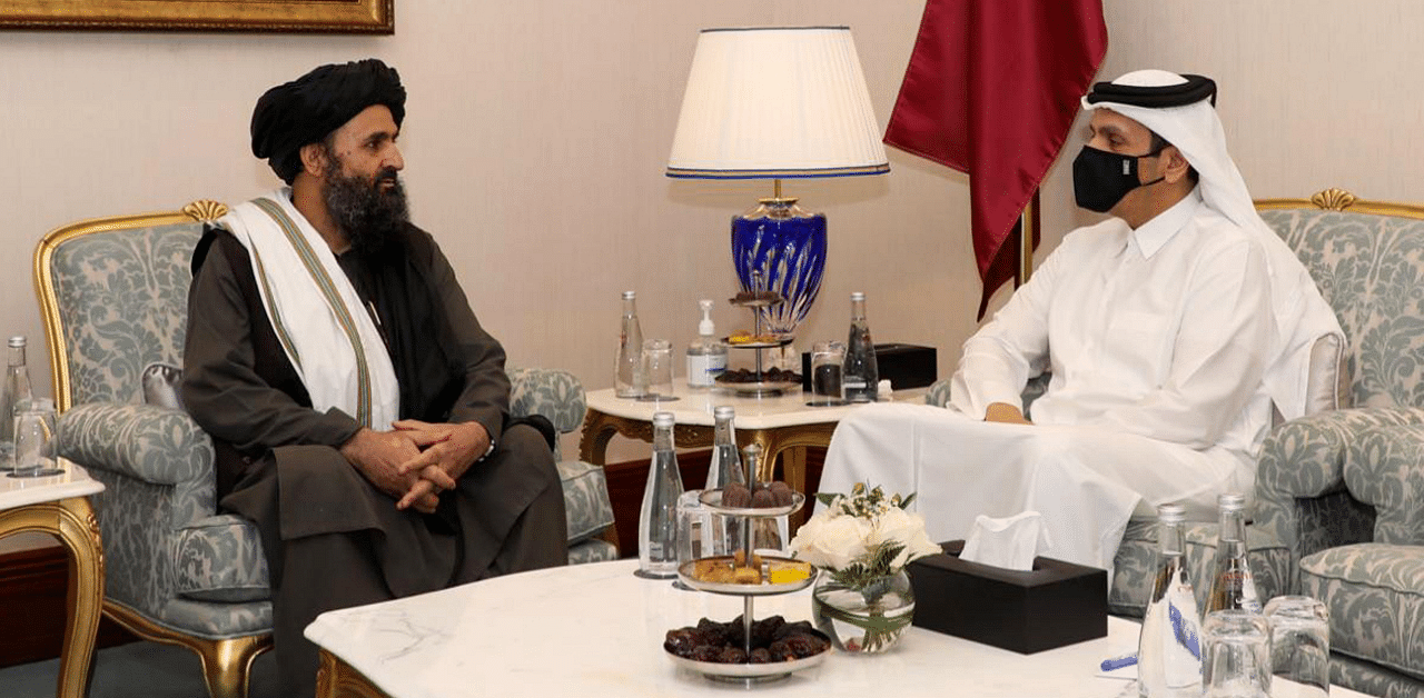 Qatar's Deputy Prime Minister and Foreign Minister Sheikh Mohammed bin Abdulrahman al-Thani(R) meeting with Taliban co-founder Mullah Abdul Ghani Baradar on the sidelines of the opening ceremony of the Afghan negotiations. Credit: AFP Photo