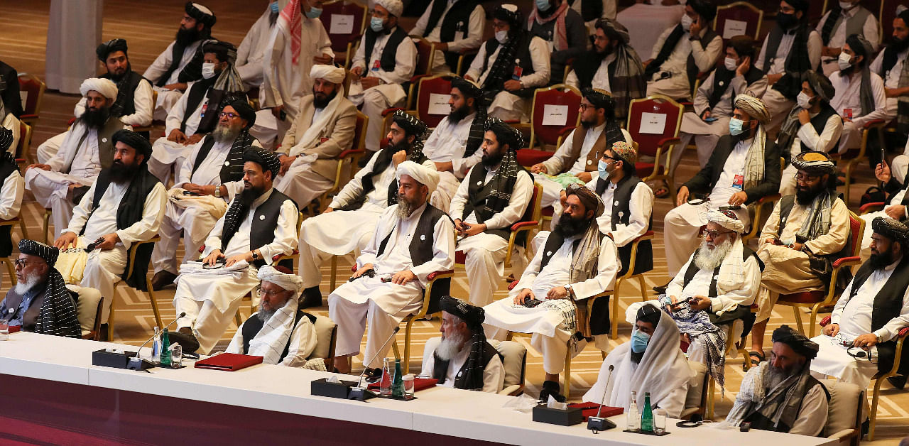 Members of the Taliban delegation attend the opening session of the peace talks between the Afghan government and the Taliban in the Qatari capital Doha. Credit: AFP Photo
