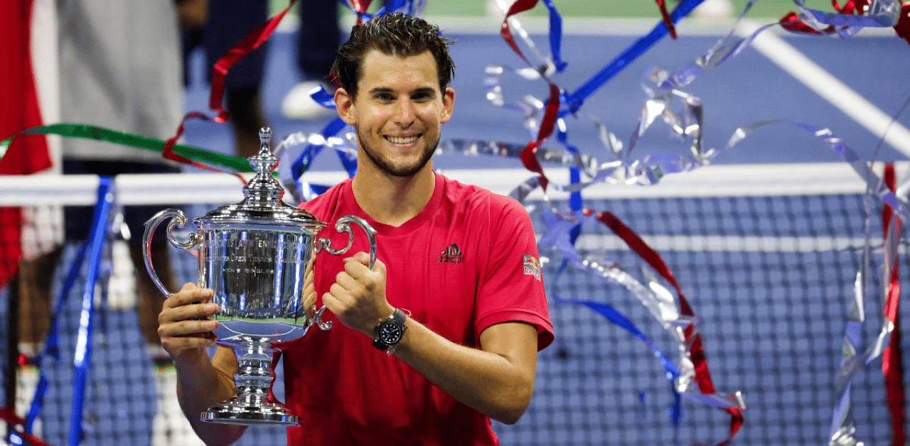  Dominic Thiem of Austria celebrates with the championship trophy after winning in a tie-breaker during his Men's Singles final match against Alexander Zverev of Germany on Day Fourteen of the 2020 US Open at the USTA Billie Jean King National Tennis Center. Credit: AFP Photo