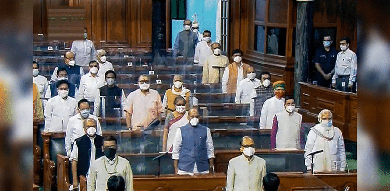 Prime Minister Narendra Modi, Defence Minister Rajnath Singh, Finance Minister Nirmala Sitharaman and others pay tribute to ex-President Pranab Mukherjee, legendary Indian classical vocalist Pandit Jasraj and others who passed away this year, during the opening day of Parliament's Monsoon Session amid the ongoing coronavirus pandemic, at Parliament House in New Delhi, Monday, Sept. 14, 2020. Credit: PTI Photo