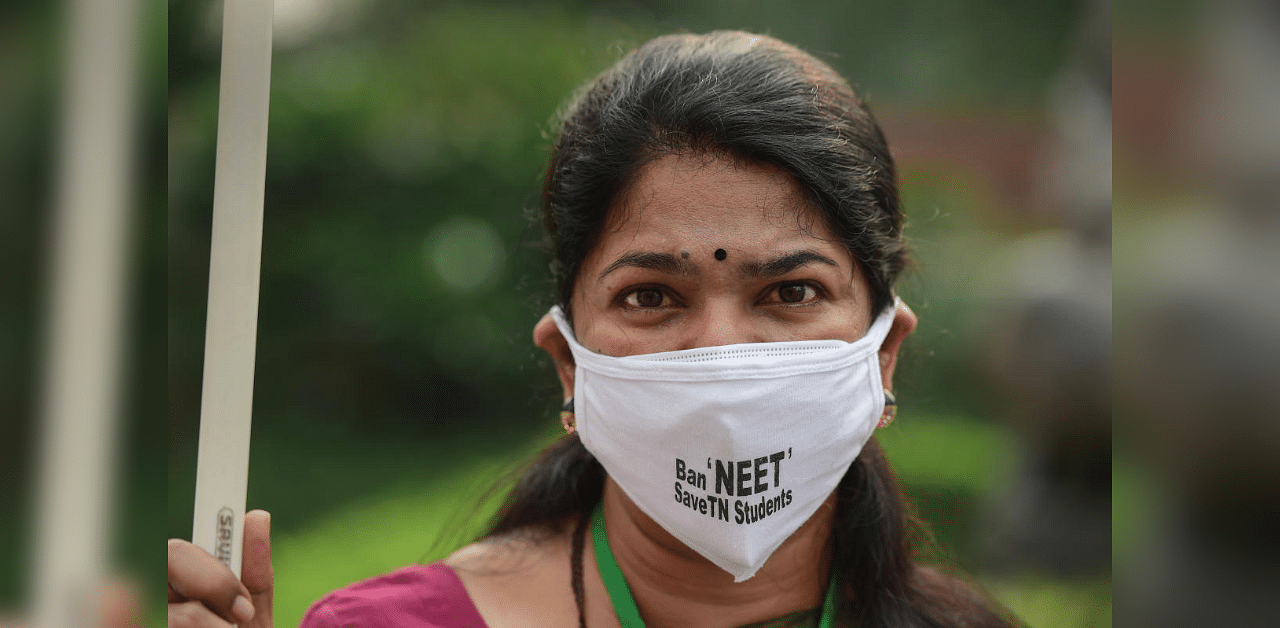 DMK MP Kanimozhi stages a protest against NEET examination before commencement of the first day of Parliament's monsoon session, at Parliament House in New Delhi, Monday, Sept. 14, 2020. Credit: PTI Photo