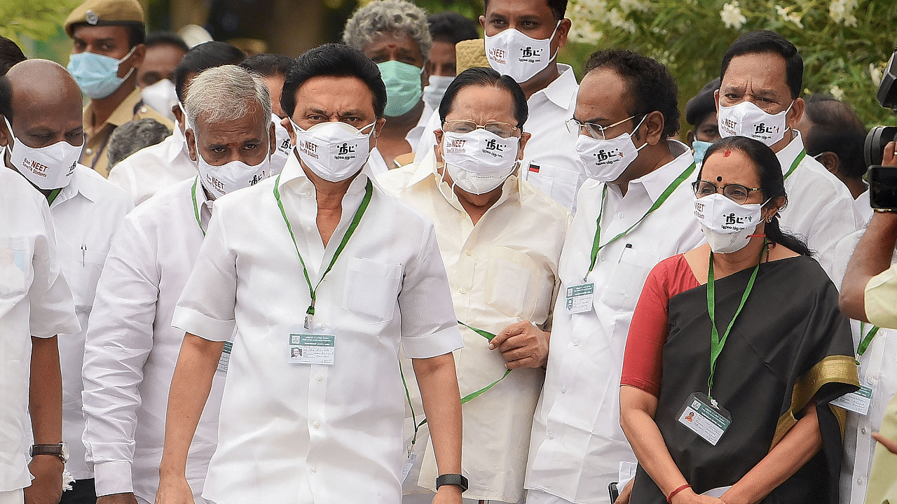 DMK President MK Stalin and his party MLAs wear face masks with 'Ban NEET, Save TN Students' written on it as they arrive to attend Tamil Nadu Assembly Session. Credits: PTI Photo