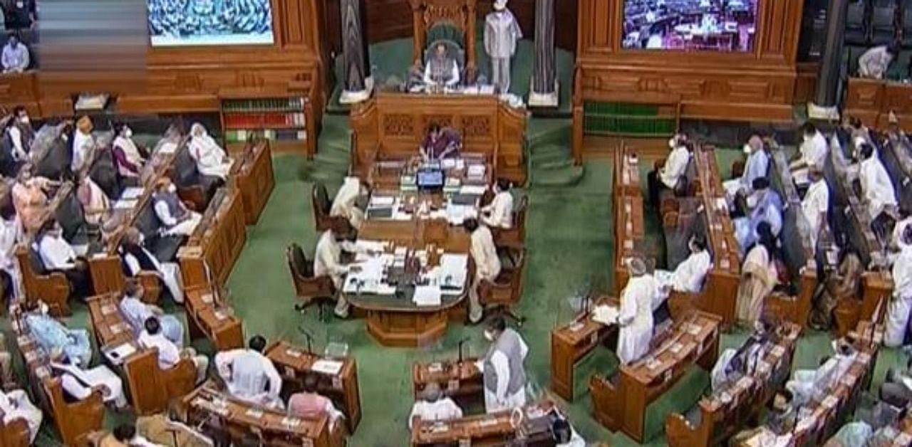 Lok Sabha Speaker Om Birla conducts proceedings during the opening day of Parliament's Monsoon Session, amid the ongoing coronavirus pandemic, at Parliament House in New Delhi. Credit: PTI Photo