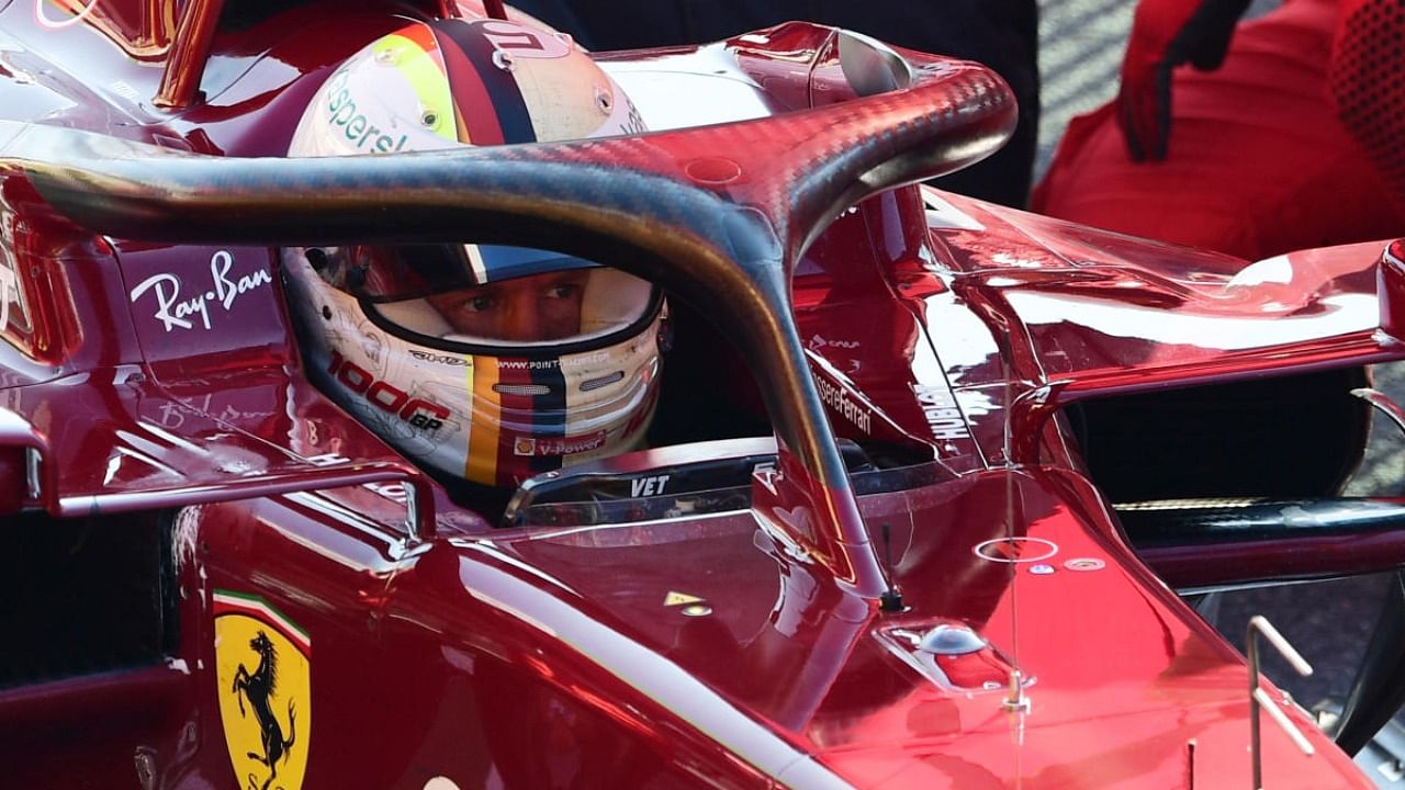 Ferrari's Sebastian Vettel looks on from his car as the race is stopped due to a red flag. Credit: Reuters/Pool