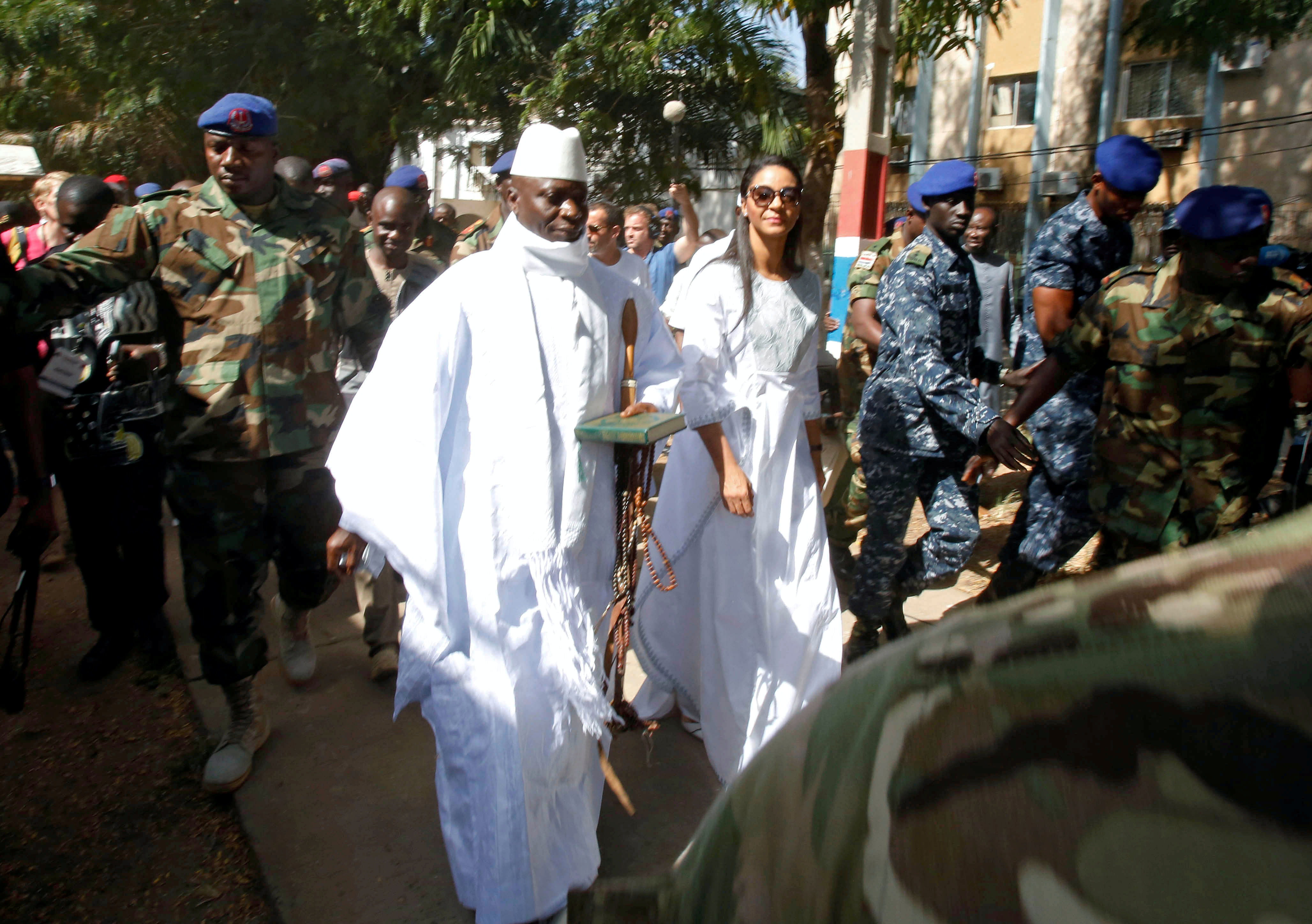 Gambian President Jammeh arrives at a polling station with his wife Zineb during the presidential election in Banjul. Credits: Reuters Photo
