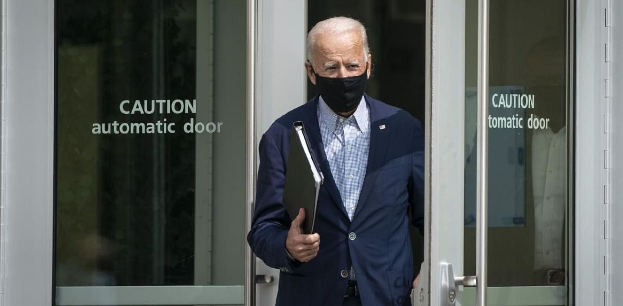 Democratic presidential nominee Joe Biden arrives to speak about climate change and the wildfires on the West Coast a the Delaware Museum of Natural History. Credit: AFP