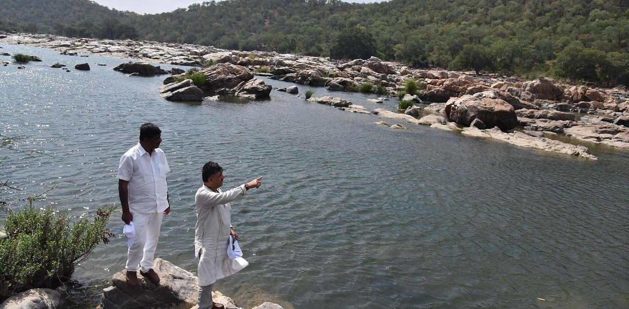Minister D K Shivakumar showing the spot identified by Karnataka Government for the project of construction of balancing reservoir cum drinking water to MP D K Suresh, at Mekedatu in Ramanagara District on Friday 07 December 2018. Credit: DH Photo