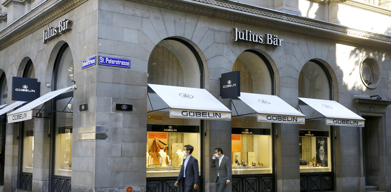 Logos of Swiss bank Julius Baer are seen above a Gubelin watch and jewelry shop in Zurich. Credit: Reuters Photo