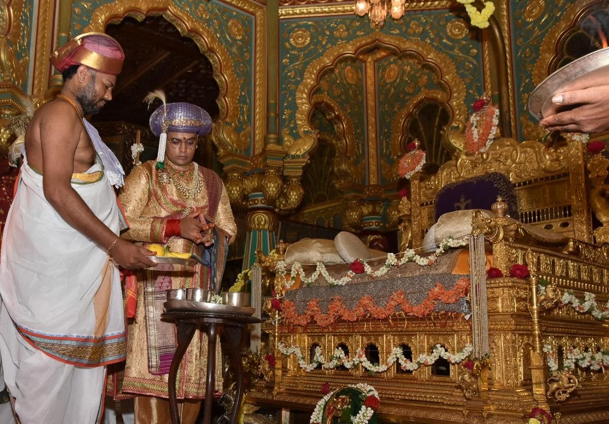 A file photo of member of the erstwhile royal family Yaduveer Krishnadatta Chamaraja Wadiyar performing puja to the golden throne at Mysuru Palace.