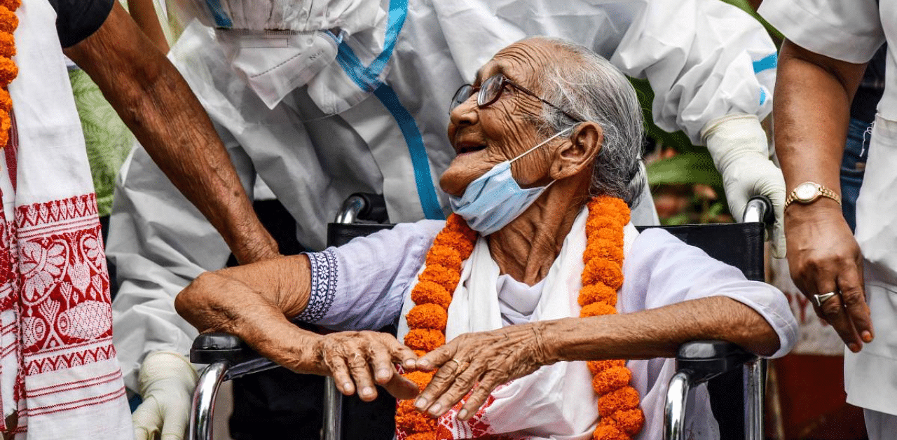 Handique, Assam's oldest Covid-19 patient, was discharged from the Mahendra Mohan Chowdhury Hospital (MMCH) in Guwahati on Wednesday. Credit: AFP Photo