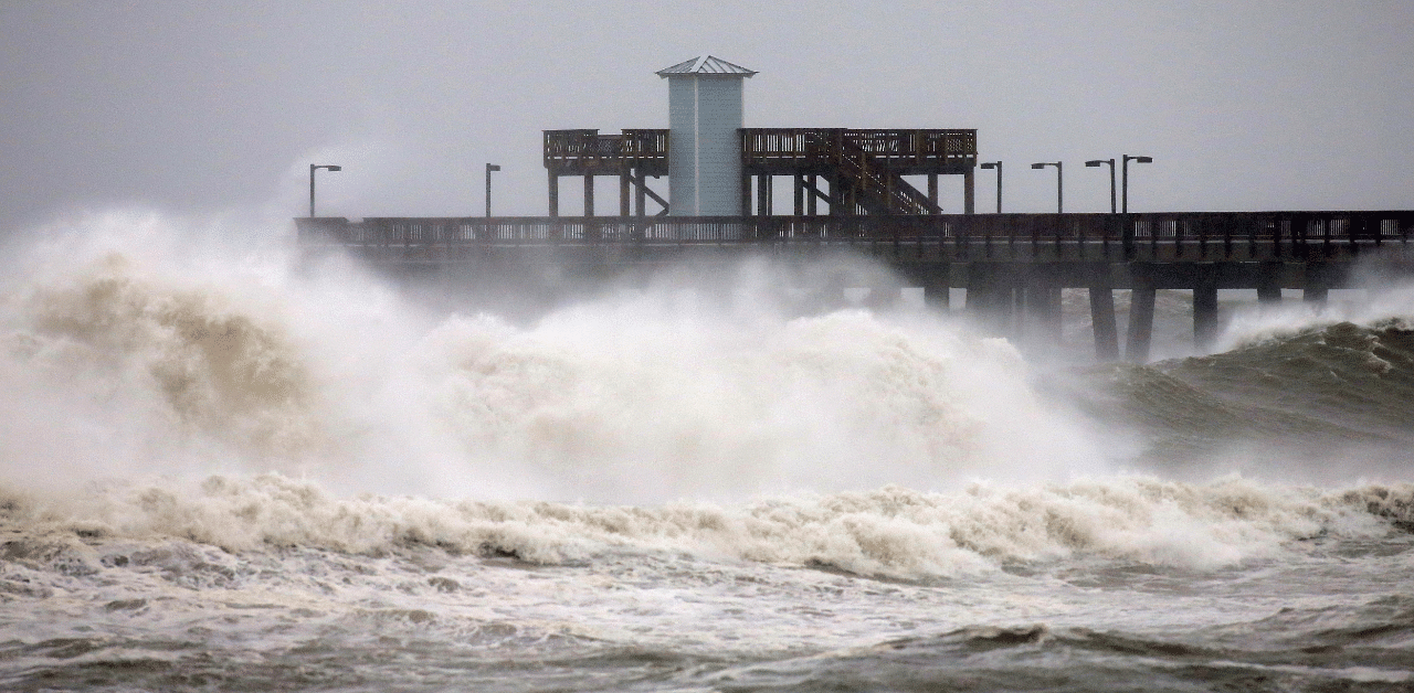 Waves crash along a pier as Hurricane Sally approaches in Gulf Shores, Alabama. Credit: Reuters Photo