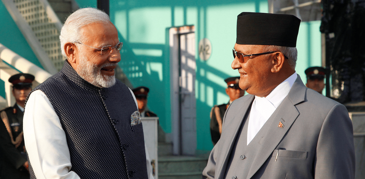 India's Prime Minister Narendra Modi shakes hand with his Nepalese counterpart Khadga Prasad Sharma Oli