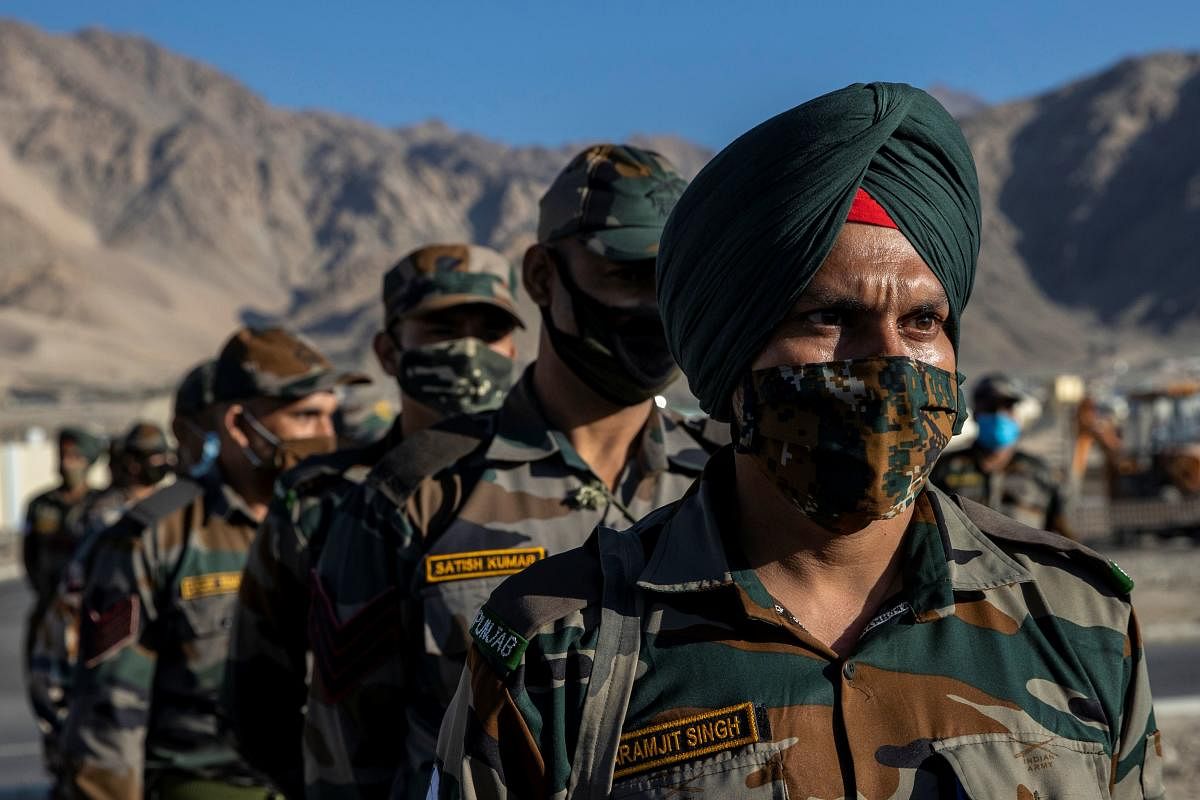 Indian soldiers stand in a formation after disembarking from a military transport plane at a forward airbase in Leh, in the Ladakh region, September 15, 2020. REUTERS/Danish Siddiqui