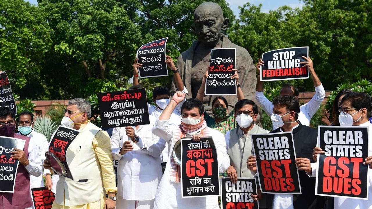 Members of various political parties stage a protest, demanding the clearance of states' GST dues, at Parliament House in New Delhi. Credit: PTI