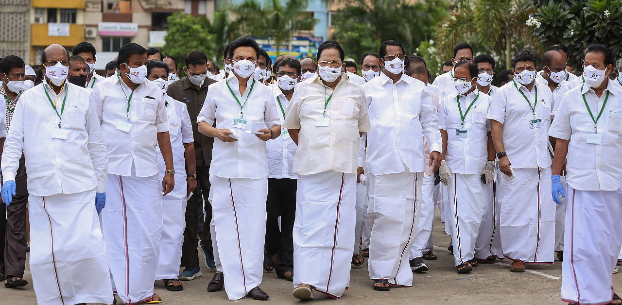 DMK President MK Stalin and his party MLAs wearing face masks with the slogan 'Ban NEET, Save TN Students' arrive to attend Tamil Nadu Assembly Session, in Chennai. Credit: PTI Photo