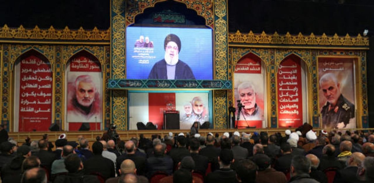 Lebanon's Hezbollah leader Sayyed Hassan Nasrallah addresses his supporters via a screen. Credit: Reuters Photo
