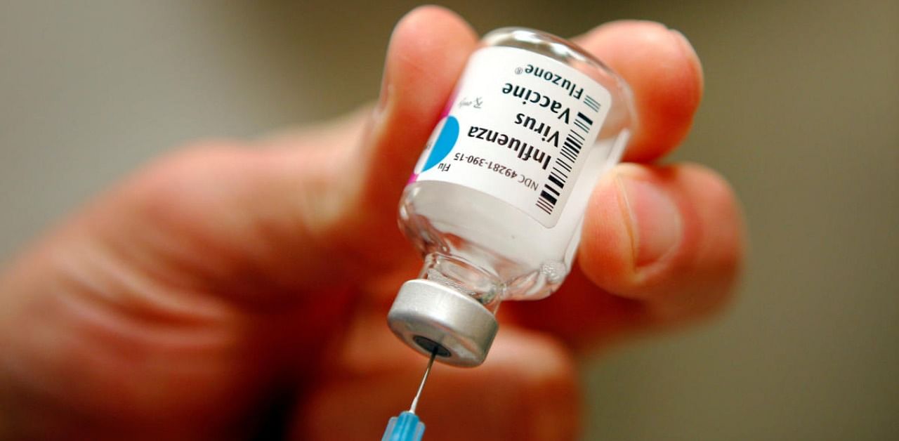 A nurse prepares an injection of the influenza vaccine. Credit: Reuters