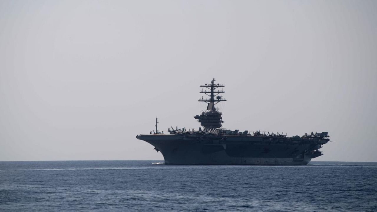 In this image released by the US Navy, the aircraft carrier USS Nimitz transits the Strait of Hormuz. Credit: AFP PHOTO / US Navy / Mass Communication Specialist 2nd Class Logan C. Kellums.