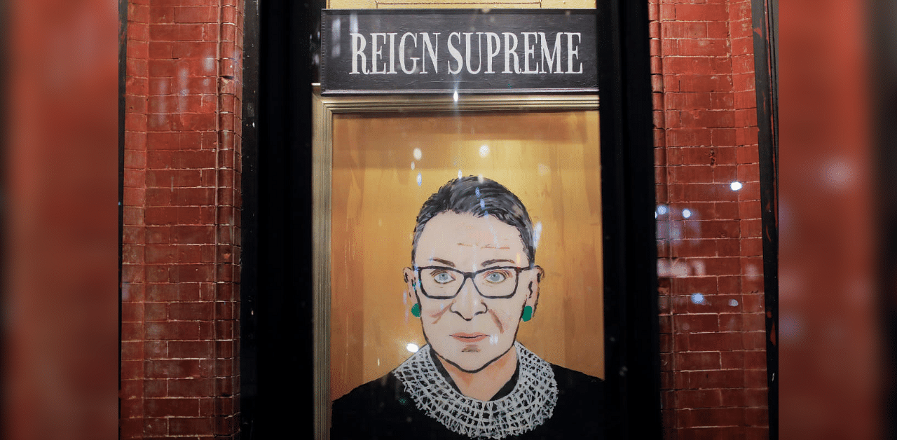 A painting is seen in a storefront on Broadway of Associate Justice of the Supreme Court of the United States Ruth Bader Ginsburg who passed away in Manhattan, New York City. Credit: Reuters