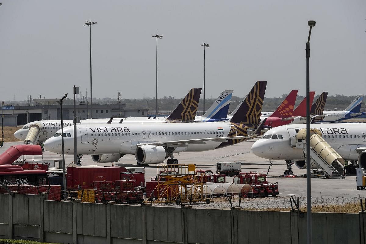 Aircrafts are seen parked at the Indira Gandhi International airport after the goverment eased a nationwide lockdown imposed as a preventive measure against coronavirus, in New Delhi. Credit: AFP