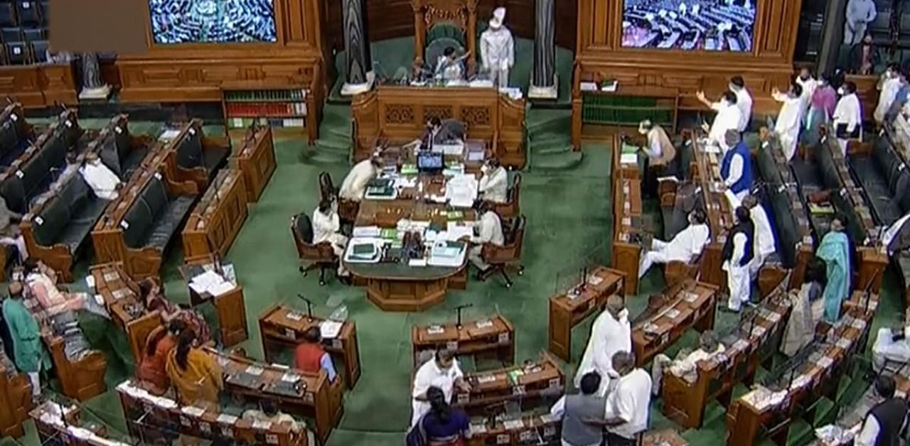 Parliamentarians in the Lok Sabha during the ongoing Monsoon Session of Parliament, amid the coronavirus pandemic, in New Delhi. Credit: PTI