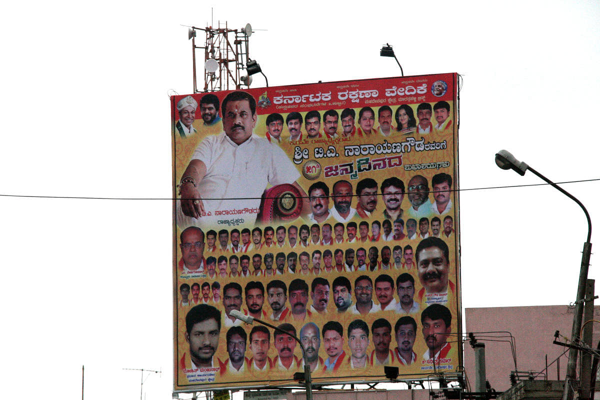 A flex banner wishing Narayana Gowda of Karnataka Rakshana Vedike on his birthday was used to illustrate the mushrooming of Kannada outfits.  Images: Ravikumar Kashi