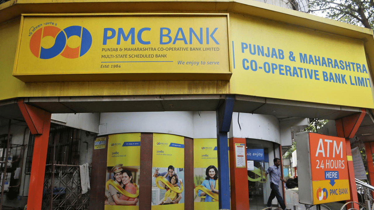 A man walks out from a PMC (Punjab and Maharashtra Co-operative) Bank branch in Mumbai. Credits: Reuters Photo
