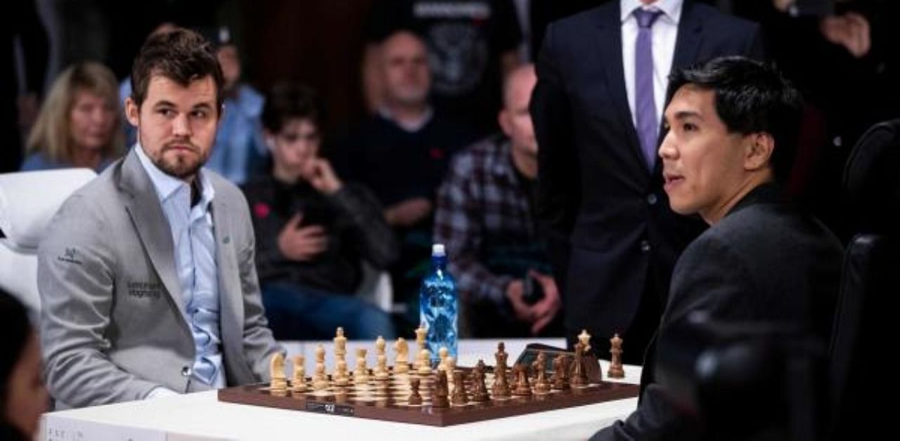 Norwegian chess Grandmaster Magnus Carlsen (L) and Filipino-American chess grandmaster Wesley So at a previous tournament. Credit: AFP Photo