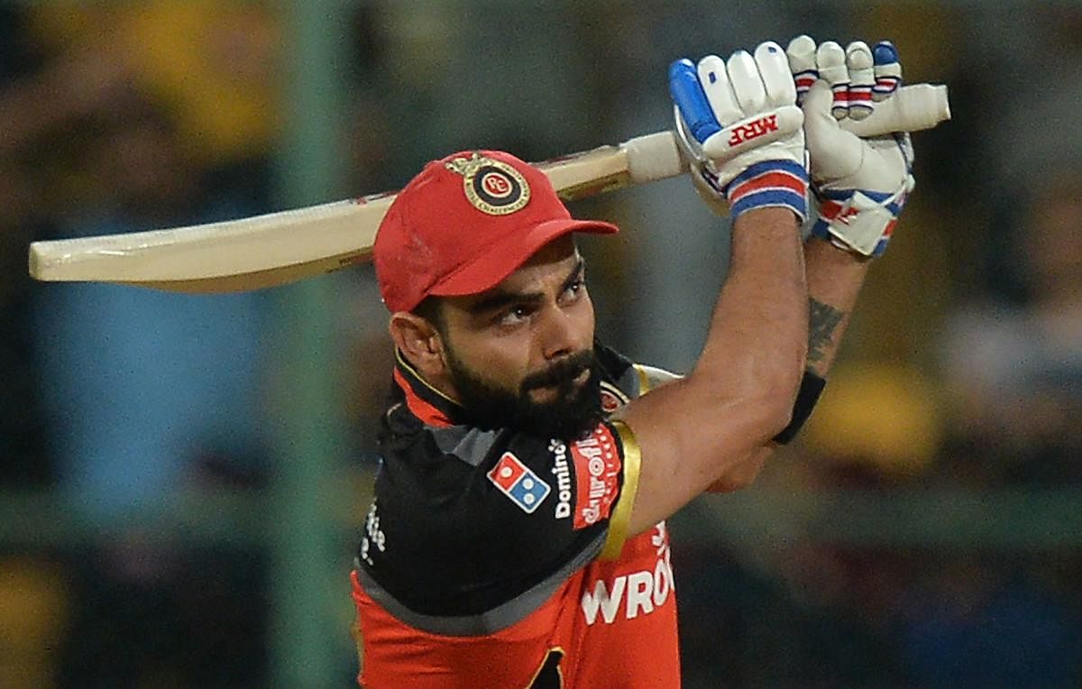 RCB skipper Virat Kohli will be looking for a blistering start when his side takes on Sunrisers Hyderabad in Dubai on Monday. AFP FILE PHOTO   