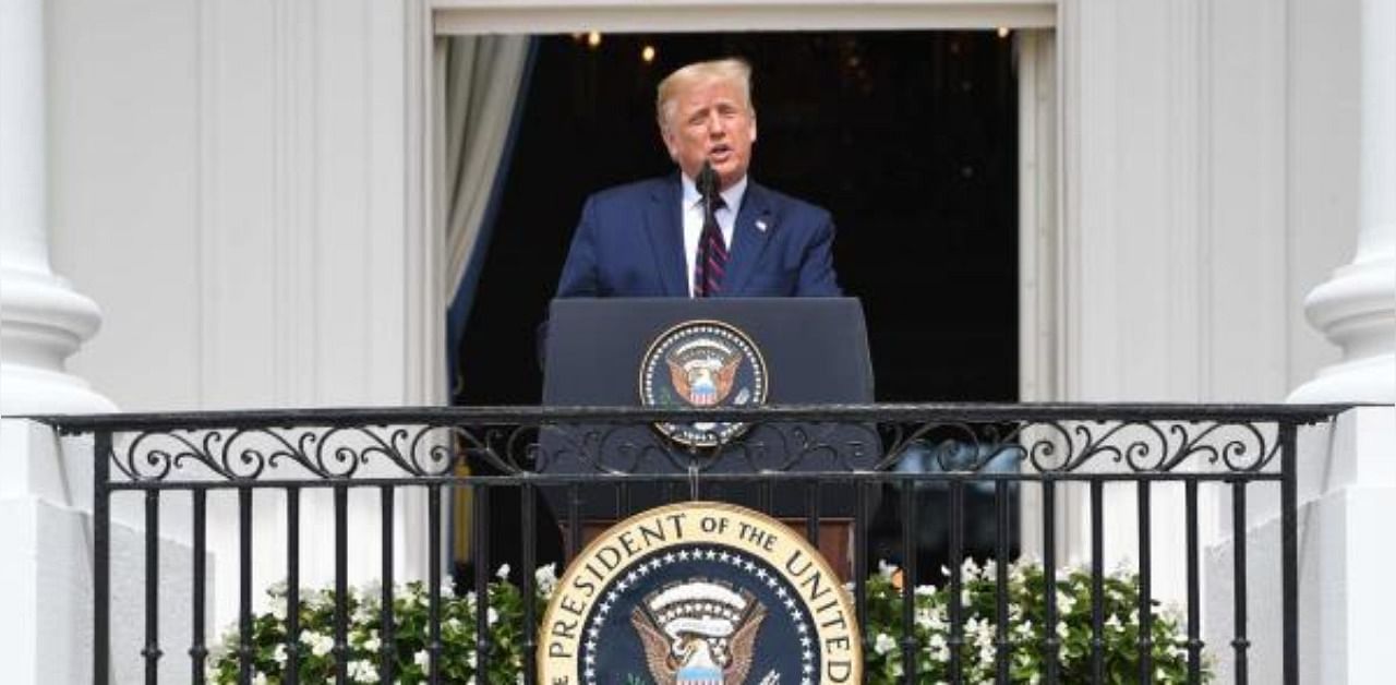 US President Donald Trump speaks from the Truman Balcony at the White House. Credit: AFP Photo
