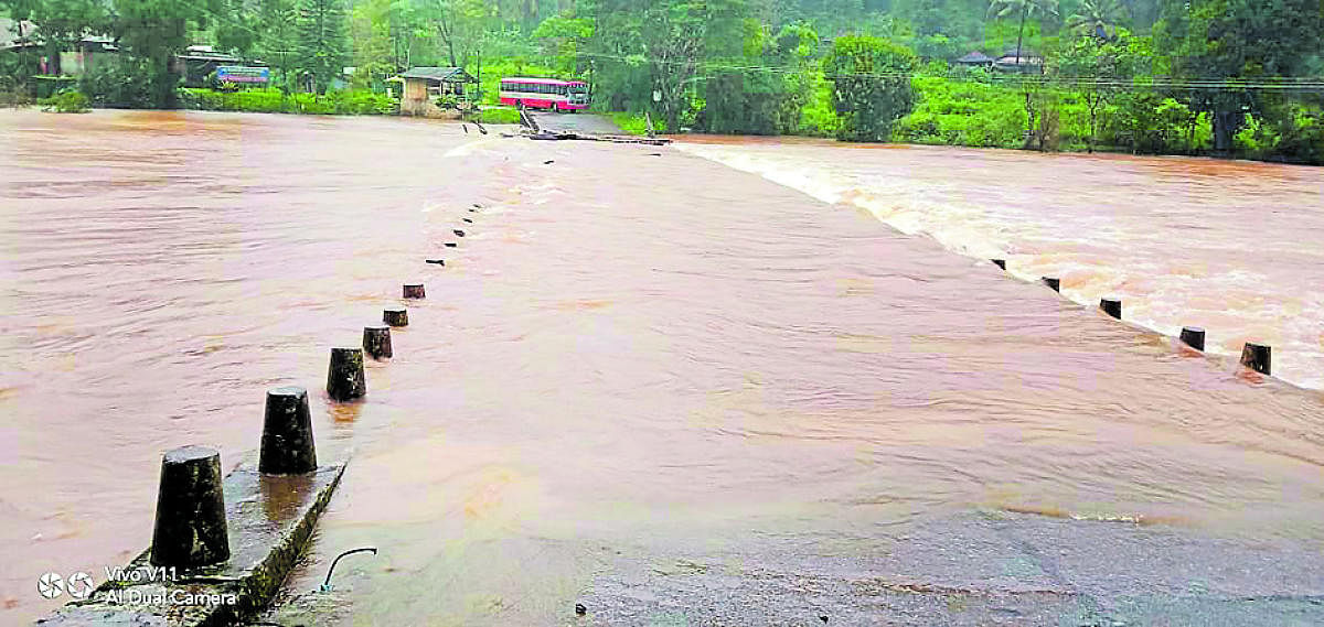 River Bhadra overflows on a bridge on Kalasa-Horanadu road on Sunday.
