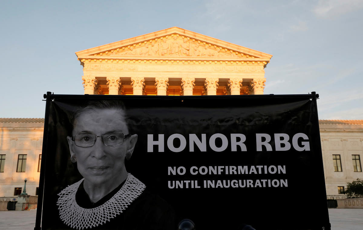 A banner with an image of the late U.S. Supreme Court Justice Ruth Bader Ginsburg and a message referring to the selection of her successor is displayed outside the U.S. Supreme Court in Washington. Credit: Reuters