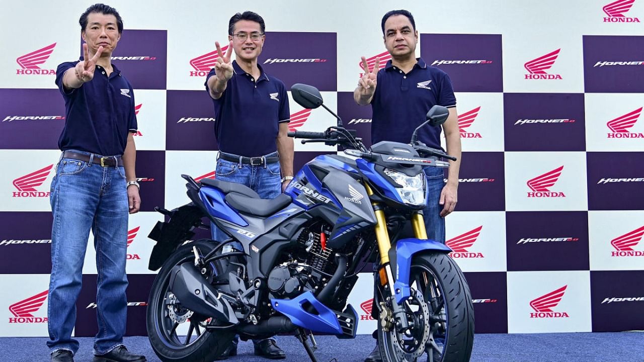 HMSI Director Sales & Marketing Yadvinder Singh Guleria and others with Honda's newly launched 180-200 cc motorcycle segment Hornet 2.0. Credit: PTI/file photo.