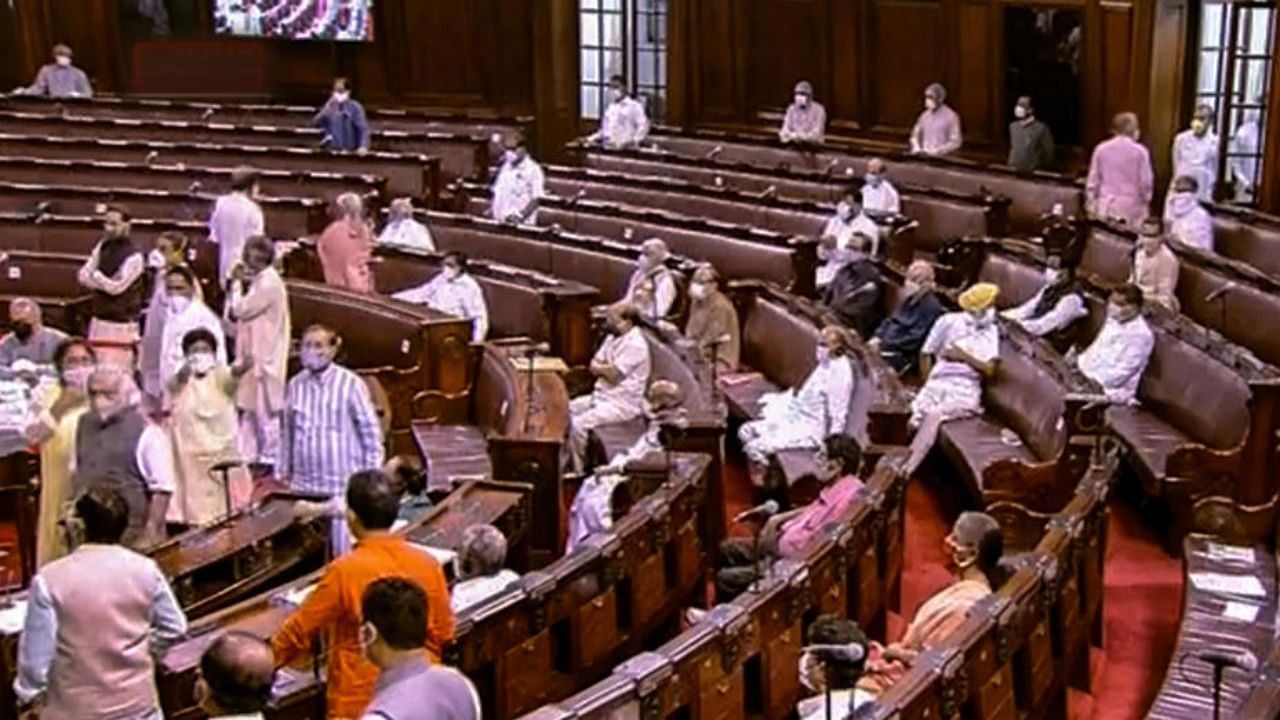 Ruckus erupts in the Rajya Sabha as Opposition rushes to Well of House over agriculture related bills, during the ongoing Monsoon Session, at Parliament House in New Delhi. Credit: RSTV/PTI.