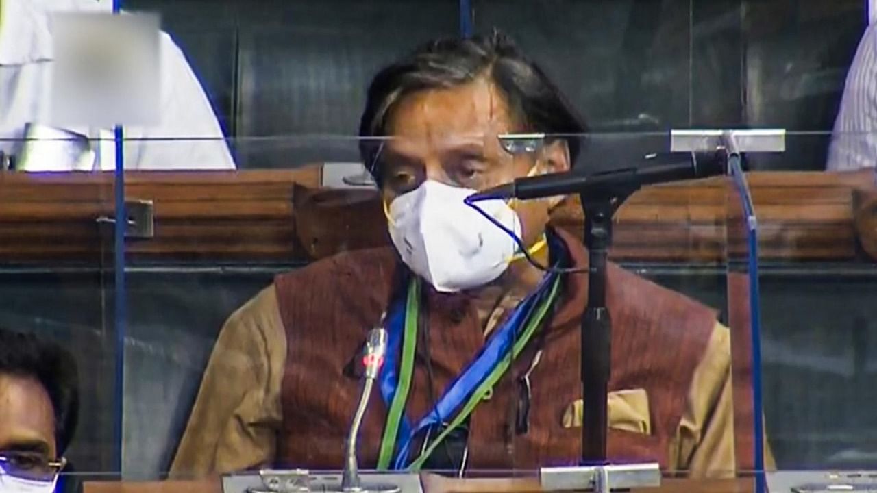 Congress MP Shashi Tharoor speaks in the Lok Sabha during the ongoing Monsoon Session of Parliament. Credit: PTI.