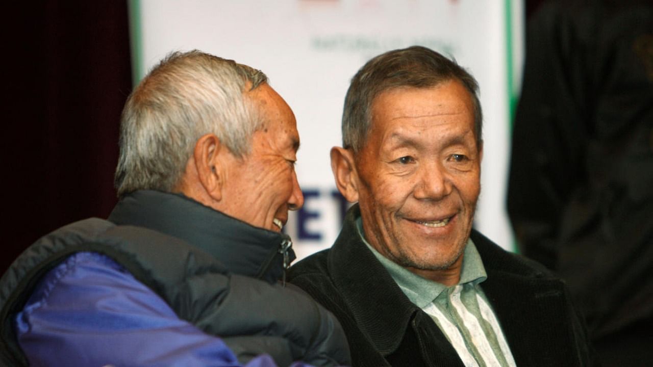 Ang Rita Sherpa (R), who climbed Mount Everest 10 times without the use of supplemental oxygen, talks to Min Bahadur Sherchan, the oldest person to scale Mount Everest. Credit: Reuters/file photo.