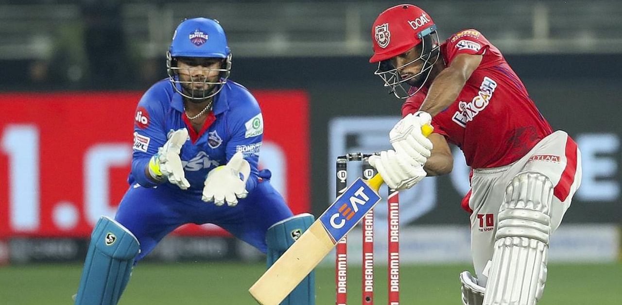 Kings XI Punjab player Mayank Agarwal plays a shot during the cricket match of IPL 2020 against Delhi Capitals. Credit: PTI