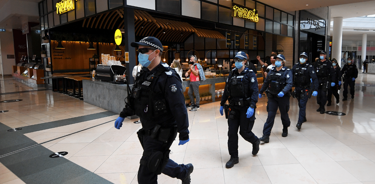Victoria Police officers patrol through a shopping centre following an anti-lockdown protest in response to the city's coronavirus disease. Credit: Reuters Photo