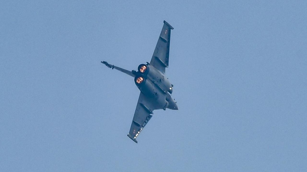 A Rafale fighter aircraft presents air display during its induction into the IAF fleet, at the air base in Ambala. Credit: PTI/file photo.