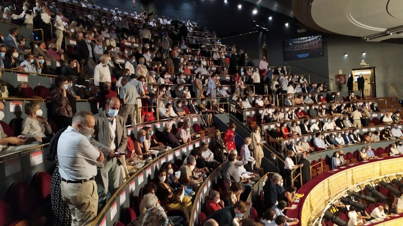 Spectators attend an opera performance which was called off after complaints over lack of social distancing, amid the outbreak of the coronavirus disease at Royal Theatre in Madrid. Credit: Reuters.