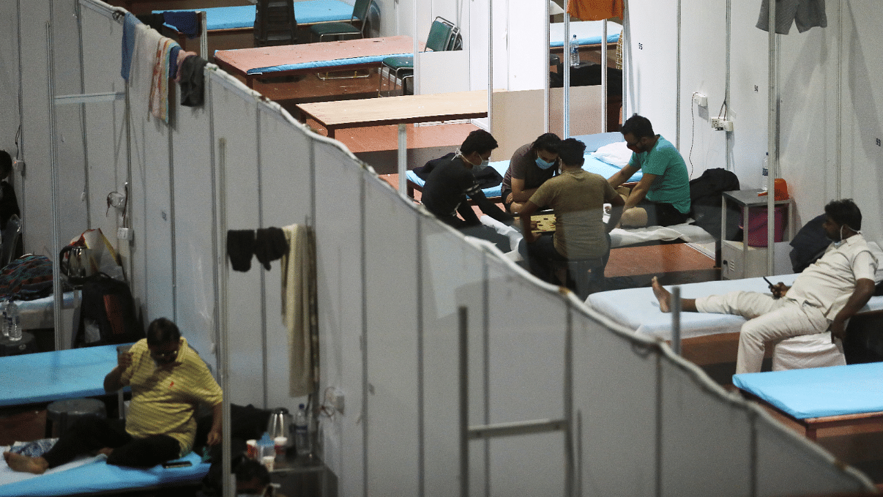 People play carrom inside a quarantine centre for the coronavirus disease. Credits: Reuters Photo