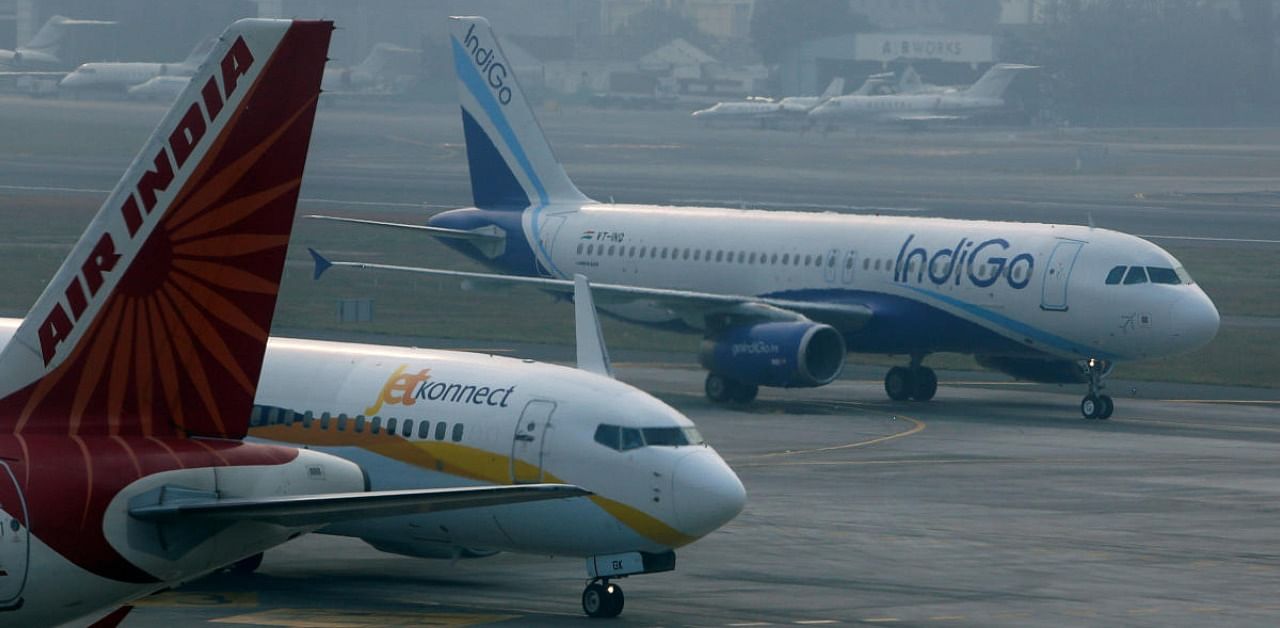 An IndiGo Airlines Airbust A320 aircraft and JetKonnect Boeing 737 aircraft taxi past an Air India Airbus A321 aircraft at Mumbai's Chhatrapathi Shivaji International Airport. Credit: Reuters