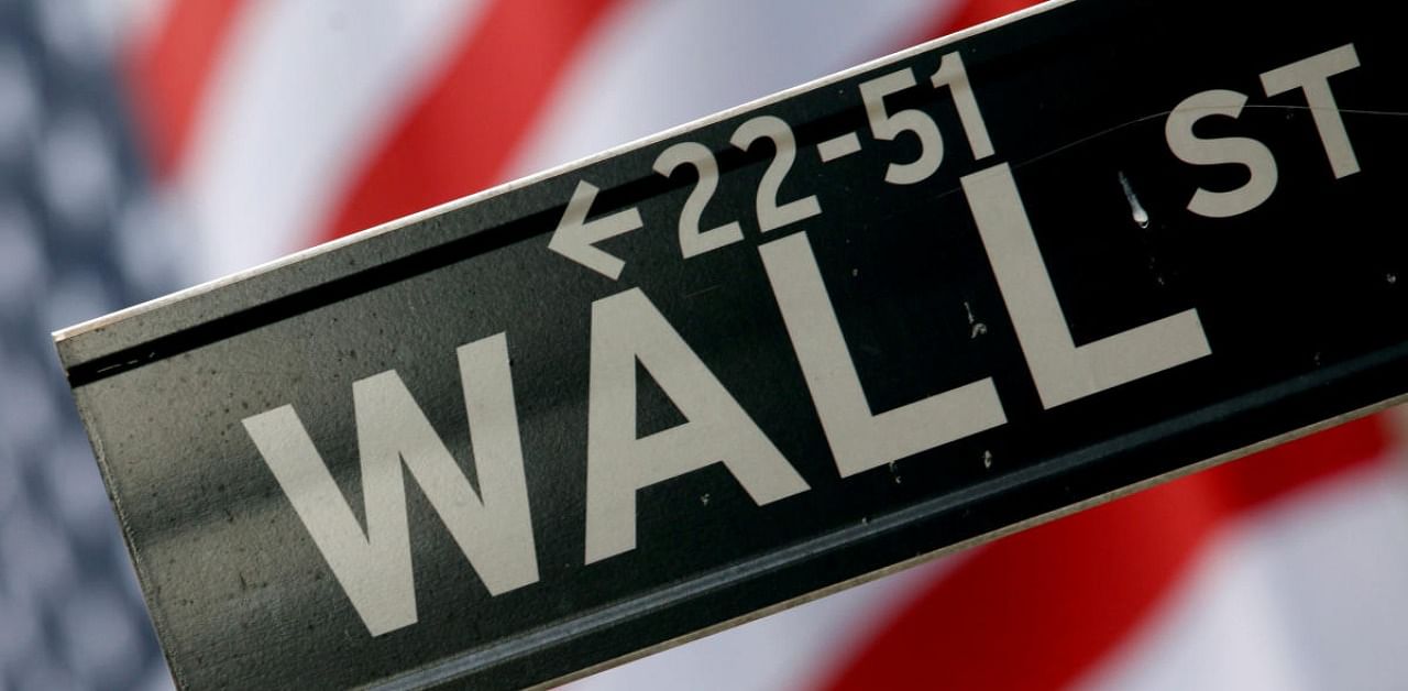 A street sign is seen in front of the New York Stock Exchange on Wall Street in New York. Credit: Reuters