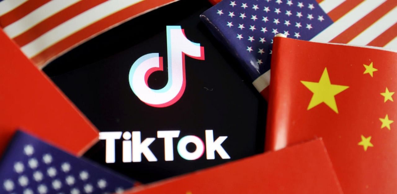 China and US flags are seen near a TikTok logo. Credit: Reuters