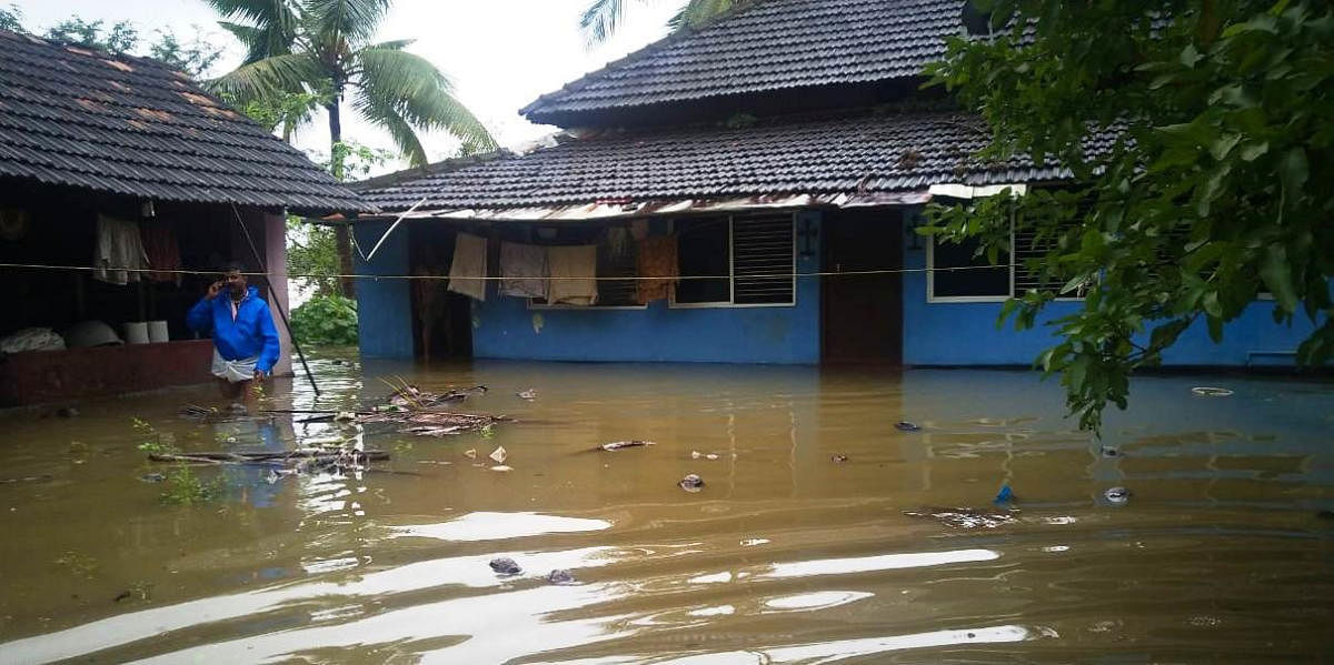 A house was marooned in floodwater at Balkudru near Brahmavar in Udupi.