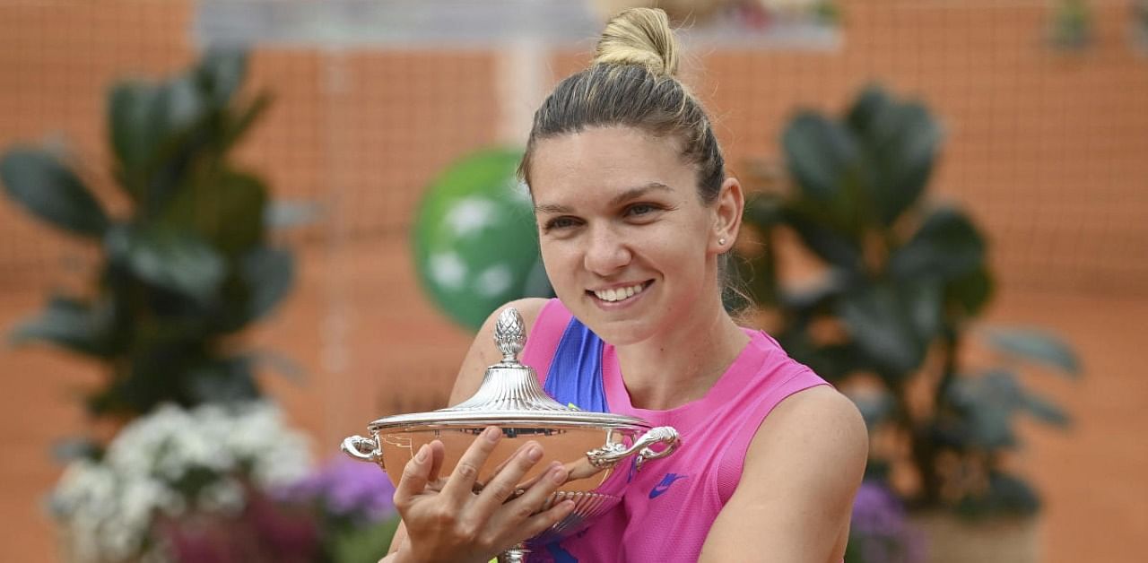 Romania's Simona Halep poses with her trophy. Credit: AP