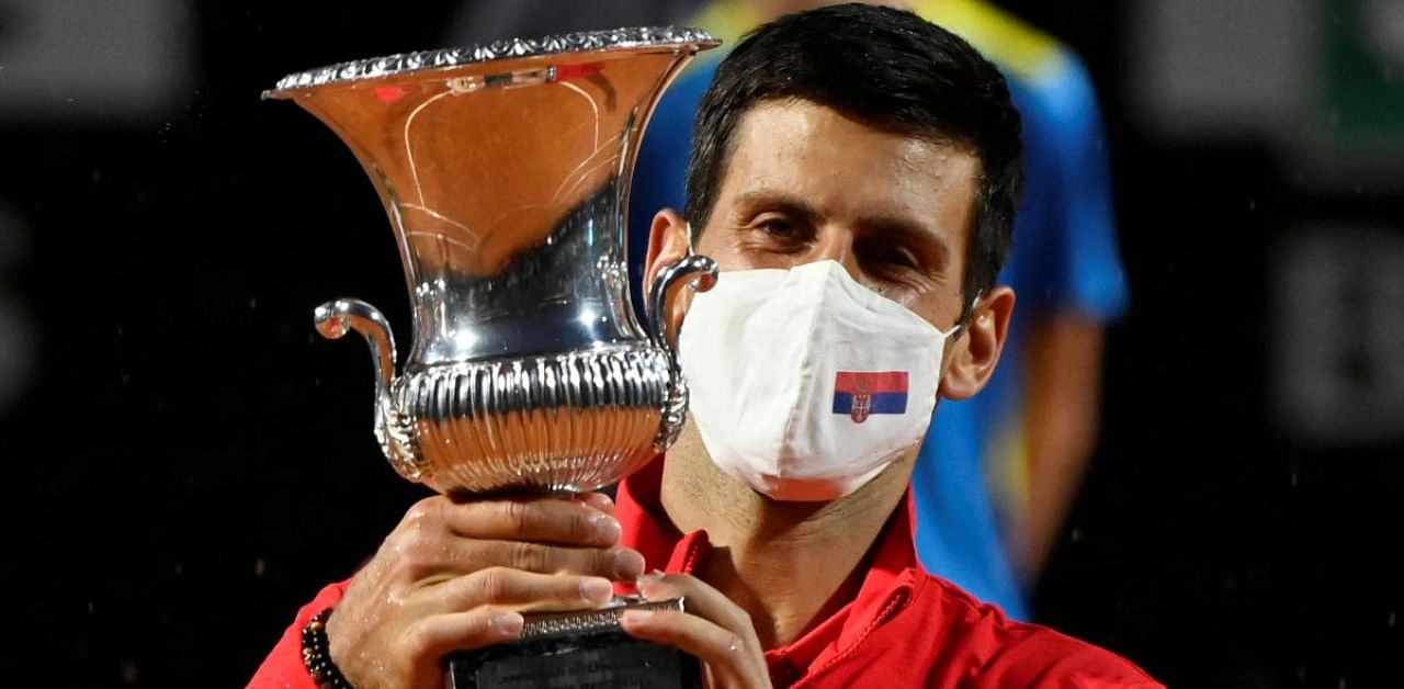 Serbia's Novak Djokovic celebrates with the trophy after winning the final against Argentina's Diego Schwartzman. Credit: Reuters