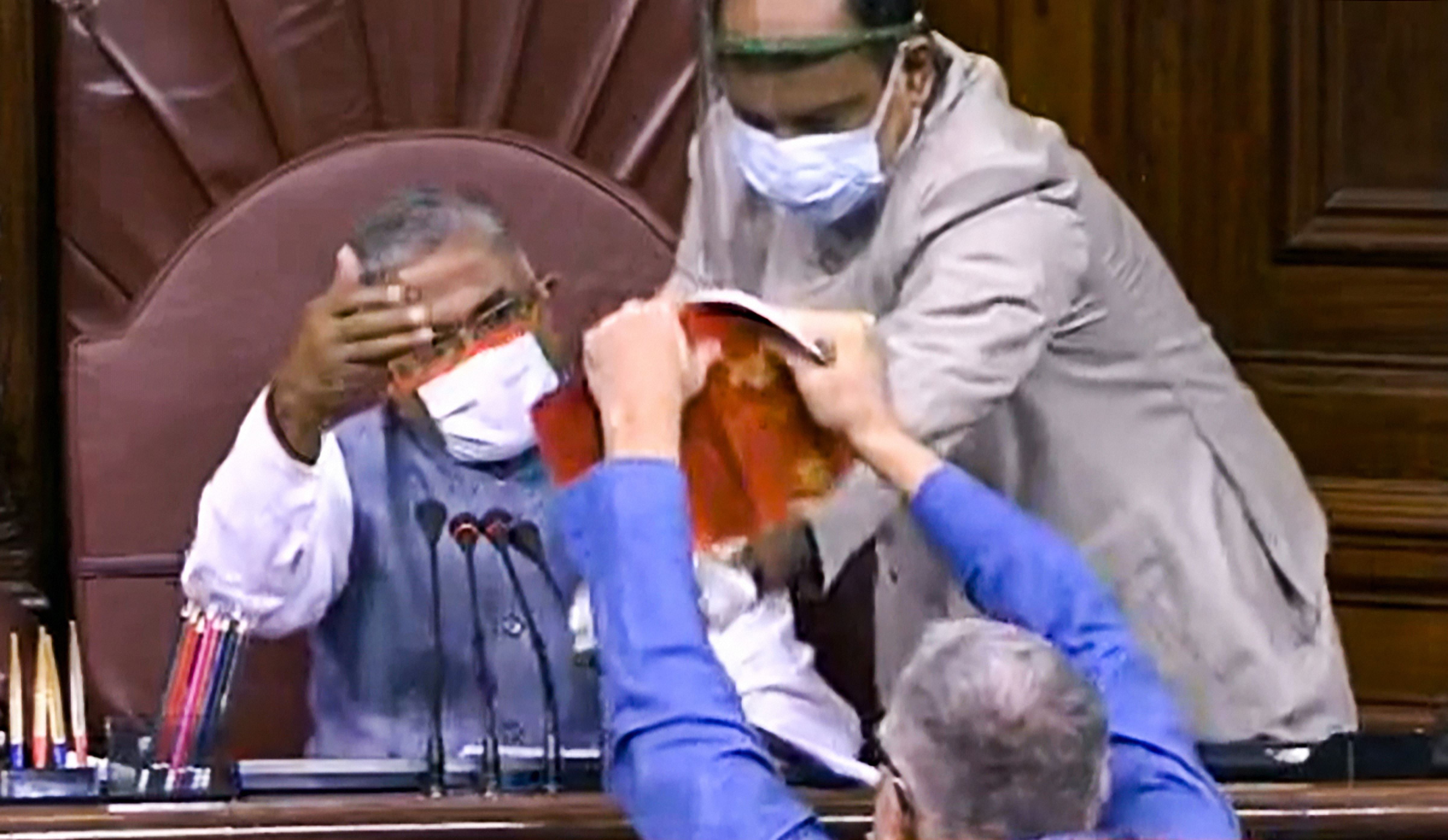 TMC MP Derek O'Brien attempts to tear the rule book as ruckus erupts in the Rajya Sabha over agriculture related bills, during the ongoing Monsoon Session, at Parliament House in New Delhi, Sunday, Sept. 20, 2020. Credit: PTI