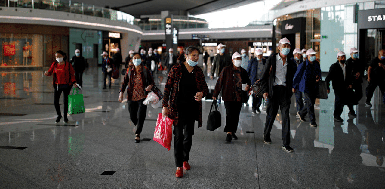 Foreigners whose residence permits expired after March 28 can apply for visas at Chinese embassies and consulates for entry. Credit: Reuters Photo